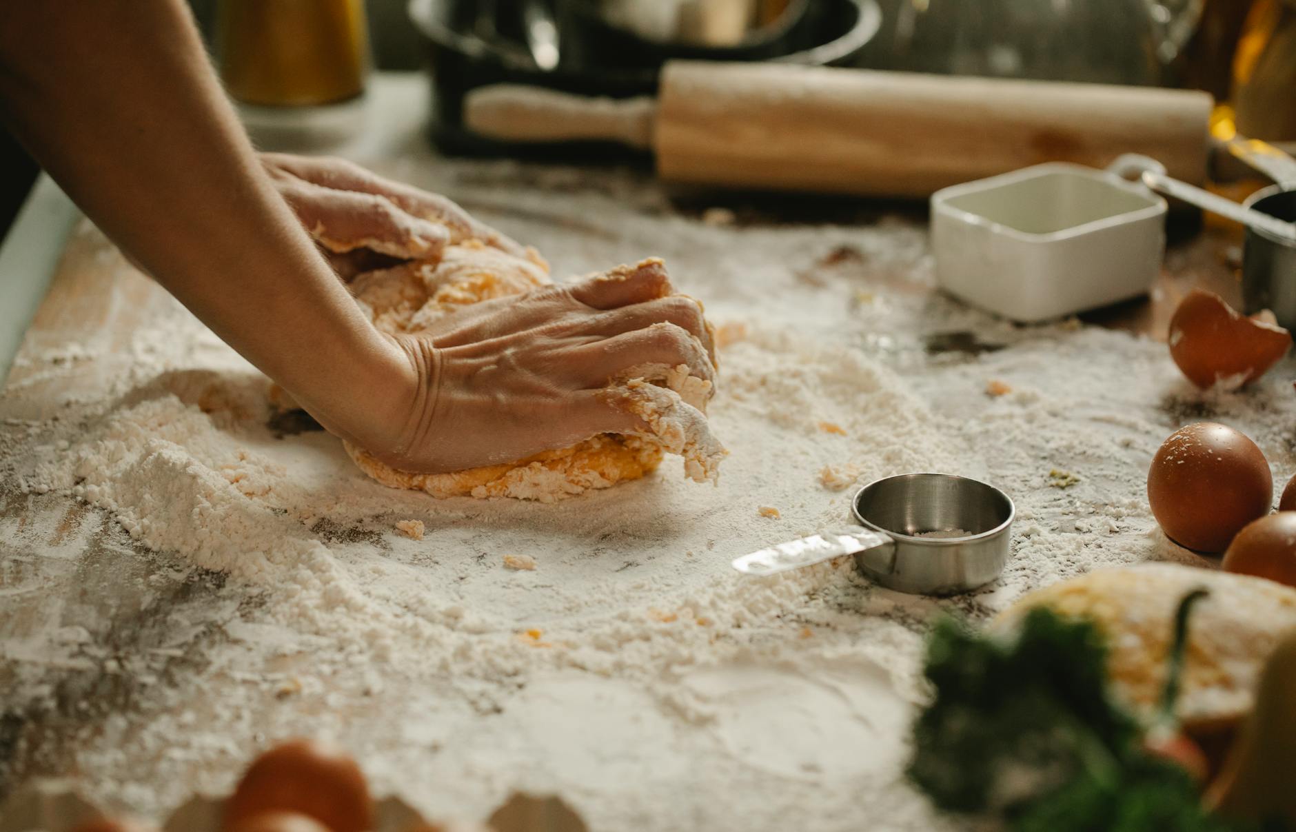 cook making homemade dough for pie in cafe